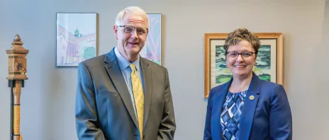 Presidents of St. Ambrose University and Mount Mercy University stand together in office.